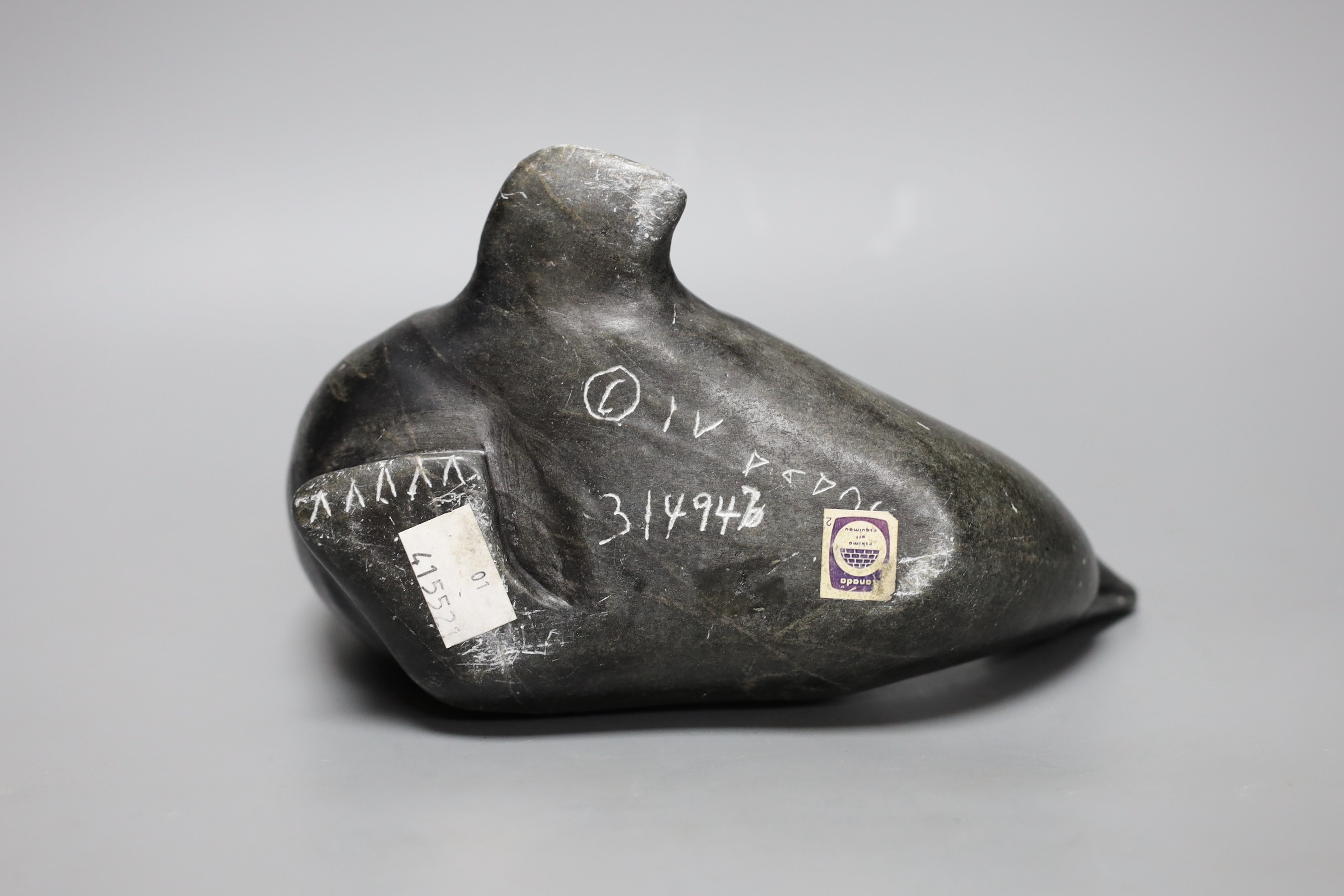 Three Inuit stone carvings, two seals and an otter. Largest 20cm long
